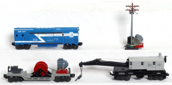 Lionel postwar O gauge 3530, 6560, 3650: Lionel postwar O gauge freight cars, full stripe 3530 EMD operating generator car with searchlight and pole, 6560 operating work crane and 3650 extension searchlight car (missing crank handle), cars l