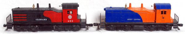 Lionel 602 and 611 NW-2 diesel switchers: Lionel postwar O gauge 602 Seaboard and 611 New Jersey Central, NW-2 diesel switchers. 602 has a repaired nose. 611 has cracks and missing piece at screw and rust on frame. Frames are C5-6 and shells