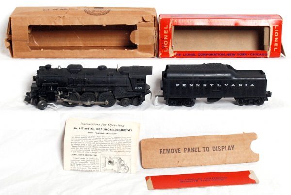 Lionel postwar No. 637 loco and 736W tender in OB: Lionel postwar O gauge No. 637 steam loco and 736W Pennsylvania tender with whistle in original boxes, loco has marker touchups, C6. Tender looks C7 area. Boxes have display panels punched out but pre
