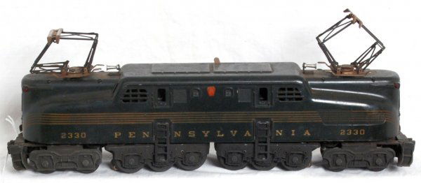Postwar Lionel No. 2330 PRR GG-1 great stripes: Postwar Lionel O gauge No. 2330 Pennsylvania GG-1 electric locomotive with great stripes, train should clean to look C7 area. Pantographs are missing insulators.