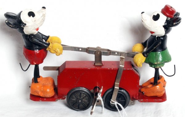 Lionel prewar No. 1100 Mickey Mouse hand car: Lionel prewar O gauge keywind No. 1100 Mickey Mouse hand car, Mickey is missing a very small portion of a shoulder and two wheels are chipped, otherwise very nice C7. Key included.