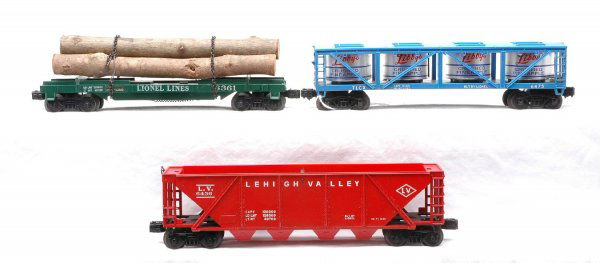 Lionel 6361 Timber 6436 Hopper 6475 Vat Car: Lionel postwar freight cars; 6361 timber car, 6436 Lehigh Valley hopper and 6475 LibbyÕs Crushed Pineapple vat car. There is some minor surface rust on the axles and base of the 6475, otherwise the c