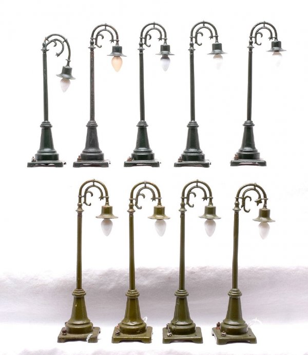 Lionel four 59 Olive Gr. five Dark Gr. Lamp Posts: Lionel prewar four 59 olive green lamp posts and five 59 dark green lamp posts. Two of the olive green lamp posts and four of the dark green lamp posts have been repainted. One of the dark green lamp 