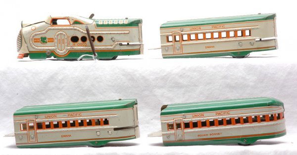 Marx Union Pacific Litho Articulated Pass Set: Marx Union Pacific lithographed green and white articulated streamlined passenger set including; wind up M10005 loco, two Omaha coaches and a Squaw Bonnet observation.