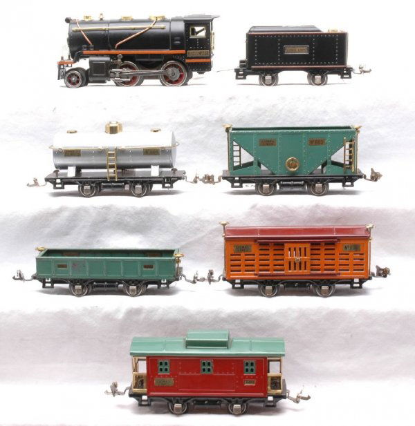Lionel Set no. 233 258 257T 803 804 806 902 807: Lionel prewar O gauge freight set no. 233, circa 1930 including a 258 steam 2-4-0 loco and 257T tender both with orange stripes, 803 peacock hopper, 804 silver tank, 806 stock car, 902 peacock gondola