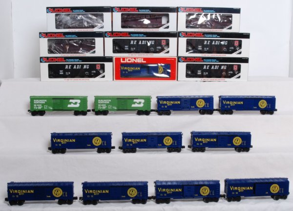 Lot of 20 Misc. Lionel rolling stock: Lot of 20 misc. Lionel rolling stock. Includes ten 9777 Virginian boxcars. One car has OB. Cars grade C6-C8. Four 19312 Reading hoppers with coal loads in OBs. C7-C8. Four 19212 Pennsylvania ramp cars