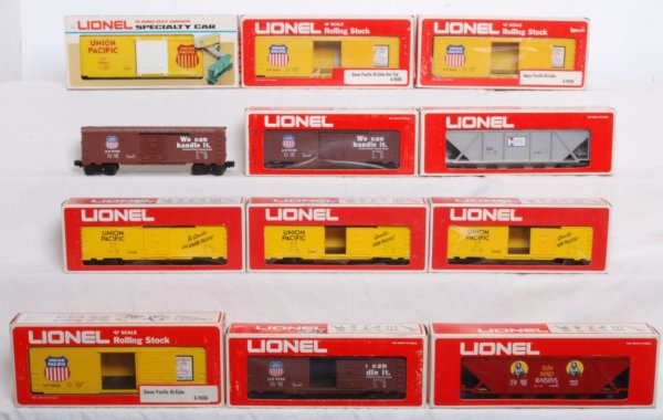 Lot of 12 Lionel rolling stock: Lot of 12 Lionel cars. Includes three 9606 Union Pacific boxcars, three 9717 Union Pacific boxcars, two 9755 Union Pacific boxcars, 9627 Union Pacific Hi Cube, 9267 Alcoa Hopper, 9261 Sun Maid hopper 