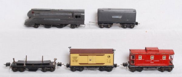 Lionel prewar No. 1688E, tender, 3651, 2655, 2657: Lionel prewar O gauge No. 1688E steam locomotive with a tender that has a whistle, 3651 automatic lumber car, 2655 boxcar and 2657 caboose. Loco cab is slightly bent, tender frame has some surface rus