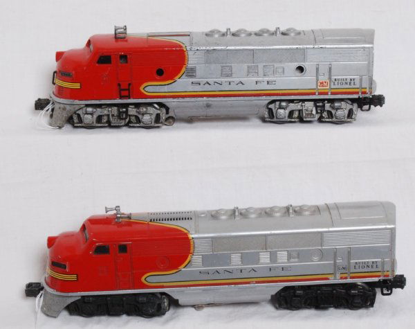 Postwar Lionel No. 2343 Santa Fe F3a units: Postwar O gauge Lionel No. 2343 Santa Fe EMD F3a units. One unit has screened roof vent, missing porthole lens, cracked roof of shell, clean battery compartment, C6 dual horizontal motors. Other has l