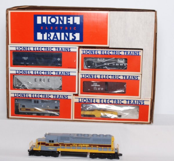 Lionel Erie Lackawanna Limited Set: Lionel 1451 Erie Lackawanna Limited Set. Includes 8458 Erie Lackawanna SD-40 Diesel Engine, 7303 Erie Lackawanna Stock Car, 6118 Erie Lackawanna Covered Hopper, 6210 Erie Lackawanna Gondola, 9474 Erie