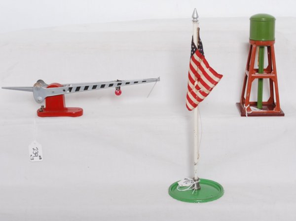 Lionel prewar accessories 90, 152, 93 in OB: Lionel prewar accessories in original boxes. 90 flagstaff and flag in worn OB. 152 crossing gate in worn OB. 93 water tank in C8+ OB. Accessories are nicer C6+.
