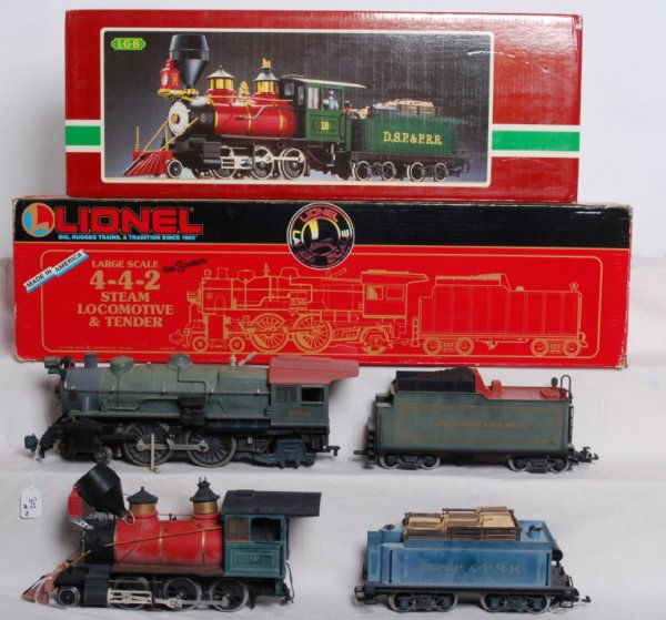 Lionel and LGB locos 4-4-2 and 0-6-0 G scale: Lot includes Lionel Large Scale 85110 Pennsylvania 4-4-2 in OB. Loco is missing side rod and crosshead on fireman side. Has broken screw mount where valve gear connects. Other than that looks C6. LGB