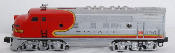 Lionel No. 2343 Santa Fe EMD F3a unit: Lionel No. 2343 Santa Fe EMD F3a dummy unit, one original porthole lens, screened roof vents. Shell has tape residue. Loco might clean very high C6+. Frame is nice, clean, shiny and has very little pa