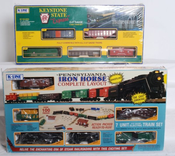 K Line Keystone State and Iron Horse sets: K Line 1712 Keystone State Express set sealed in factory plastic. Set features Pennsylvania Alco 2105, Jersey Central boxcar, Erie hopper and PRR caboose. Set is assumed C10. K1107 Iron Horse set in O