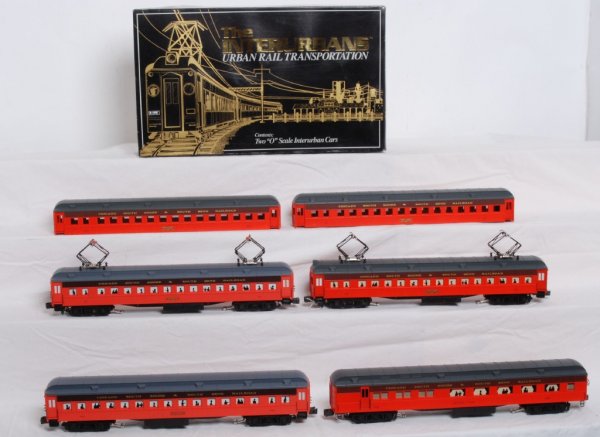 Four car South Shore Set K Line: Four car K Line Chicago South Shore and South Bend cars. K2701A set. Cars are #21 powered, #201 dummy, #33 powered, and #302 dummy. Also includes extra 201 and 22 shells. Locos are C7-8 with a very sm