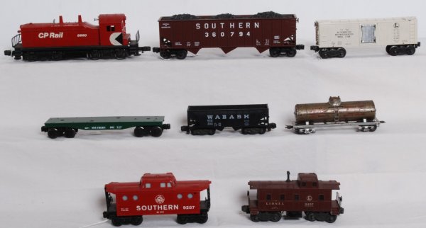 Mixed lot of Lionel locos and cars: Lot includes Lionel 8660 CP rail switcher in C5-6 condition, 1994 LCCA Southern hopper with coal load, 3472 milk car with a few repro cans. C5-6, 6457 caboose with white overspray on one side. C4-5, K