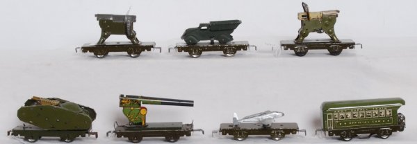 Marx military freight cars, w/loads: Marx O gauge military freight cars. Illuminated Army Supple Train Official Car, flatcar w/repainted airplane, flatcar w/cannon, flatcar with tank (missing flint holder), flatcar w/repainted truck, fla