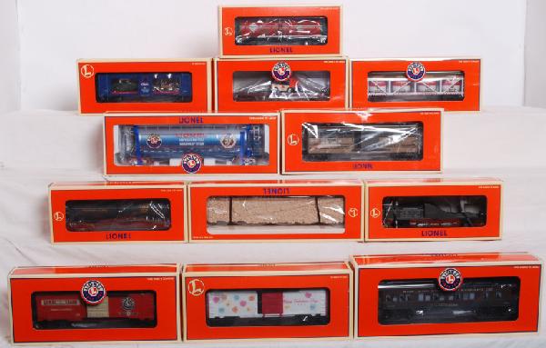 Lionel LRRC, Carail. and other modern cars: Lot includes 52188 Carail auto carrier, 16951 Southern bulkhead flatcar, 19995 LRRC 25th Anniversary car, 17171 Lionel hopper, 26013 flatcar with zamboni, 16751 Airex television car, 16180 Tabasco tan