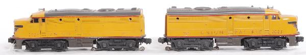 Postwar Lionel 2023 Union Pacific Alco A units: Postwar Lionel 2023 Union Pacific Alco diesel A units. Both units have distorted shells, powered unit has rusty battery bracket and a penny sized touchup to yellow of cab roof. Units are nicer C6.