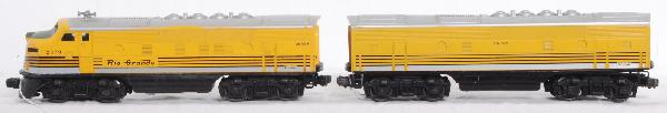 Postwar Lionel No. 2379 Rio Grande F3 A-B: Postwar Lionel No. 2379 Rio Grande F3 A-B units. Powered unit has repro nose decal, repainting to frame, cleaned battery area, etc., C5. B unit has nice stripes, nicer C6.