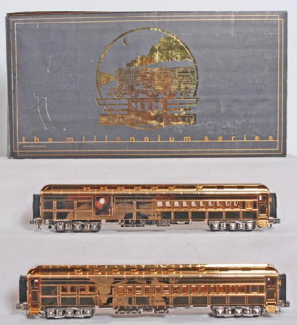 MTH Millennium series gold NYC passenger cars: MTH 20-4129 Millennium series gold plated New York Central passenger cars in OB. Cars are Robert E. Weaver and Jerome M, Williams. OB has slight water damage to one end. Cars are high C8-9 with very c