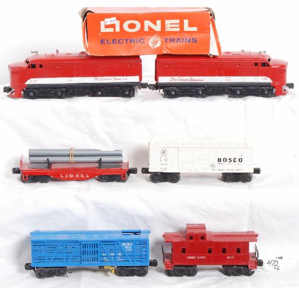 Postwar Lionel 210, 6014, flat, 3376 in OB, 6017: Postwar Lionel O gauge 210 MKT Texas Special Alco A units, 6014 Bosco boxcar, unnumbered flatcar with pipe racks, 3376 operating Bronx Zoo giraffe car and 6017 caboose, powered unit has broken pilot.