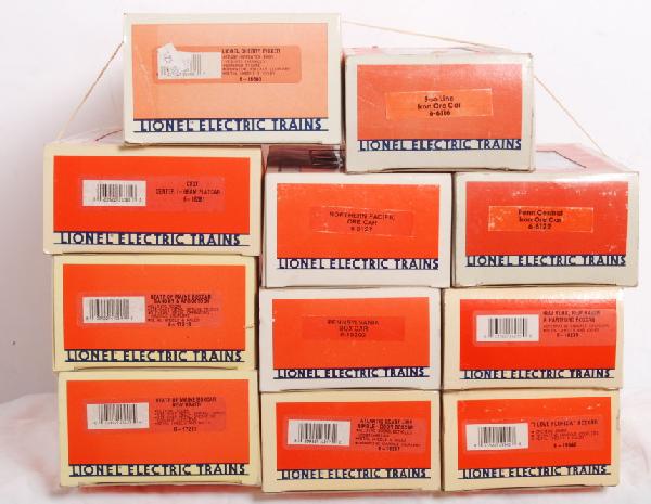 11 Lionel nixed freight cars: Lot of 11 Lionel freight cars. Lot includes 6116 Soo ore car, 6127 Northern Pacific Ore car, 6122 Penn Central ore car, 19942 I love Florida boxcar, 16247 Atlantic coast line boxcar, 16238 New Haven b