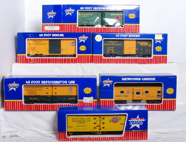 USA Trains C&NW boxcars, caboose, refrigerators: USA Trains G Scale freight cars and caboose all in OBs. All cars are Chicago and Northwestern. Cars include R16289 refrigerator, R16508 Refrigerator, R16514 refrigerator (Has broken ladder below one d