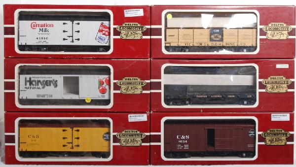 10 Delton refers and boxcars, Busch, Strohs, etc: Lot of 10 Delton Locomotive Works G Scale freight cars in OBs. Cars include two 4255A4 Busch boxcars, two 4258 Strohs refrigerator cars, Florence and Cripple Creek flatcar 105, Victor gold mining gond