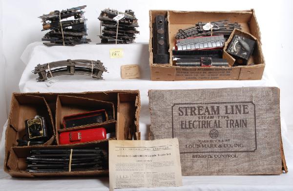 Partial Marx sets in OB and 027 R.C. switches: Two partial postwar O gauge Marx train sets in partial original boxes. Two box bottoms, one lid. Lid is marked for No. 4612. One bottom includes an unnumbered tinplate 0-4-0 steam loco, 1427/37956 Pen
