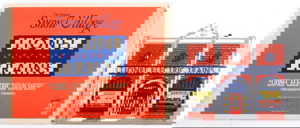 Lionel Department 56 hobby shop 1st run: Lionel Department 56 Hobby shop first edition produced for Allied Model trains. Differences from normal production run includes Lionel artwork on building and in windows. Also lacking bushes in front