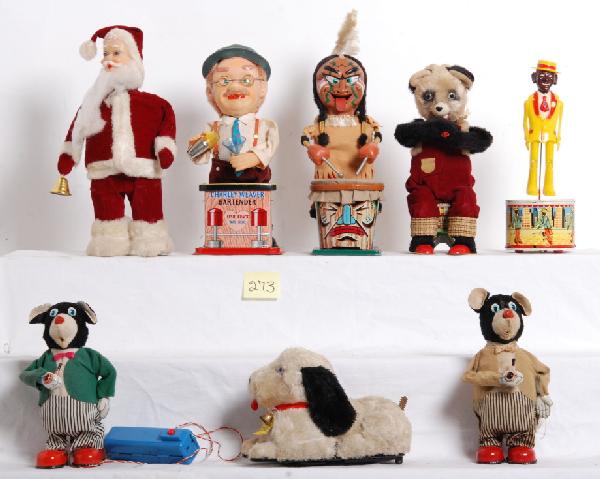 Lot of eight battery operated toys, Marx Indian: Lot of eight battery operated toys, Marx Indian, Charlie Weaver Bartender, Line Mar dog (missing tail and rust spot at battery compartment), two SAN Bear Smoking Pipe (one is missing the controller/ba