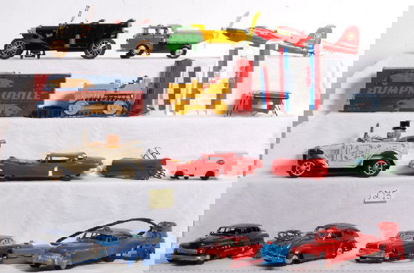 Eleven battery operated vehicles, airplane, truck: Eleven battery operated forms of transportation. Vehicles are cars, an air plane, two trucks and a bull dozer. Some are tethered with a remote controller. Some are bump an go. Bull dozer has a broken