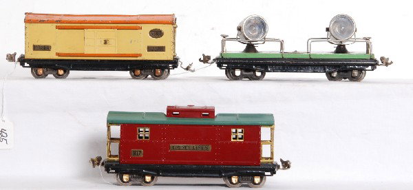 Lionel prewar No. 820, 814, 817 O gauge freight: Lionel prewar O gauge No. 820 searchlight car, No. 814 automobile furniture car and No. 817 caboose (repainted). Trains look C5.