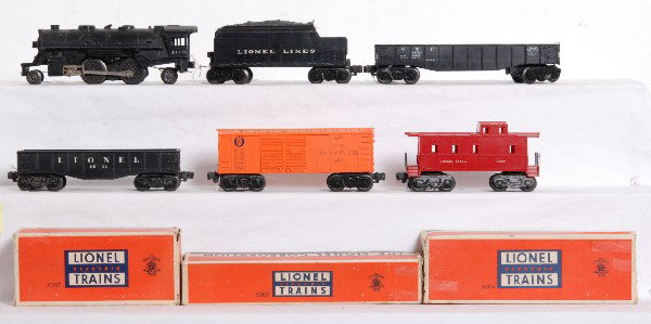 Lionel 1110 loco, tender, 6004, 6032, 6002, 6007: Lionel 1110 loco and tender with 6004 Pennsylvania Baby Ruth boxcar (chipped catwalk end), 6032 gondola, 6002 New York Central gondola and 6007 caboose (shell is cracked at screw). Trains look C5-6. 6