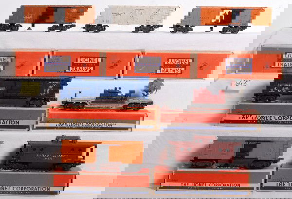 Lionel 3464, 6472, 3464, 6417-25, 6520, 6472, 6468: Postwar Lionel No. 3464 New York Central operating boxcar, two 3464 A.T.&S.F. operating boxcars, 6472 RT milk car reefer, 6468 Baltimore and Ohio double door automobiles boxcar and 6417-25 porthole ca