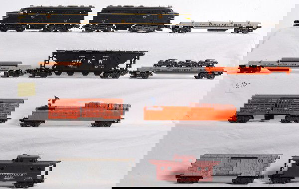 Lionel 2032 Erie Alcos with 6362, 3562, 3454, 3361: Postwar Lionel O gauge No. 2032 Erie Alco diesel A units with repro nose decals, 6362 rail truck car with postwar load, 3656 stock car on clear mold, two 3361 flatcars with three logs (mold color vari