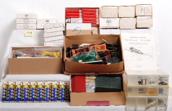 Lot of Lionel parts and other items: Large lot of Lionel parts and other items. Seven small parts bins, and several boxes of parts. Nice lot of restoration, fixer up type items. Please view the photographs for the best description and as