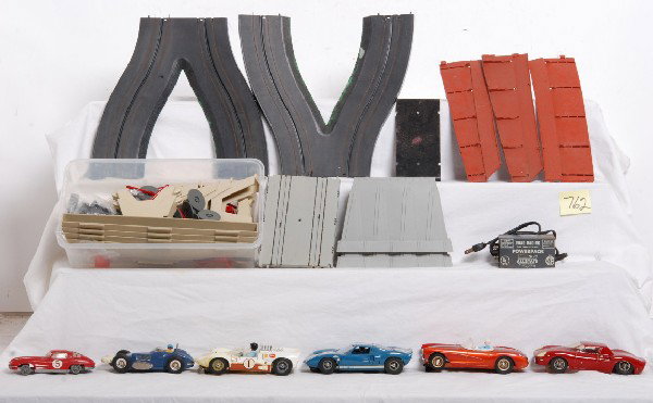 Larger scale slot cars, Cox, Lionel, Strombecker..: Larger scale slot cars two have parts marked Cox. Lionel, Strombecker, Eldon, Marx, American Flyer/A.C. Gilbert and possibly others. One car has what appears to be a home made chassis/frame. Cars appe