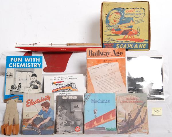 Lot of toys, books, space ship, sail boat....: Lot includes an Ideal sea plane, two inflatable space ships, wooden toy sail boat, small stack of project and informational books and other various items. Please view the photographs for the best desc