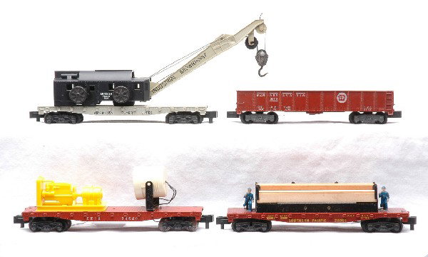 Am Flyer Freight Cars 24410 24569 25058 24569: American Flyer S gauge freight cars; 24110 Pennsylvania gondola, 24569 Industrial Brownhoist crane, 25058 Southern Pacific flatcar with wood load and a 24569 Erie floodlight car. The cars are C7.