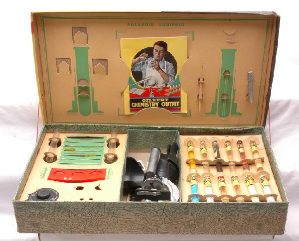 A.C. Gilbert no. 8 Microscope Set Boxed: A.C. Gilbert no. 8 microscope set with test tubes, Polaroid Junior microscope, accessories and instruction sheet in cardboard OB. OB is intact and has bright color graphics.