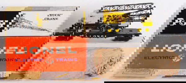 Lionel No. 6828 flat w/Harnischfeger truck crane: Postwar Lionel O gauge No. 6828 flatcar with Harnischfeger truck crane in original boxes with wrapping material and other components. Flatcar is unrun C9-10. Crane is unassembled, C9-10. Inner box is