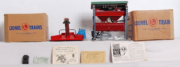 Postwar Lionel No. 397 and No. 497 coalers in OB: Postwar Lionel O gauge No. 397 operating coal loader in original box with instructions sheet, components envelope, inspection slip, 364c control button and service stations booklet. Loader and box loo