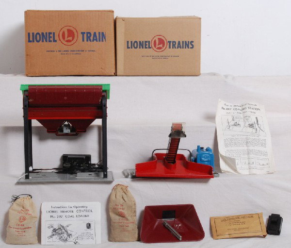 Postwar Lionel No. 397 and No. 497 in OB: Postwar Lionel No. 397 operating coal loader, with 364C, red bin and steel posts and 206 and No. 497 coaling station with 206, controller and components in original boxes, C7 area. 497 OB is lower C8.