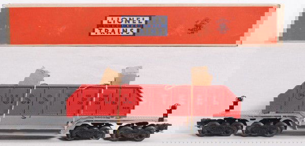 Lionel No. 6418 machinery car in OB: Postwar Lionel O gauge No. 6418 machinery car in original box with inserts and original load restraints, unrun C9 area. Box is C8+.