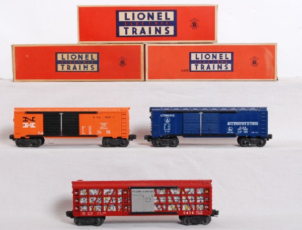 Lionel 6468, 6468-25 and 6434 in OB: Postwar Lionel O gauge 6468 Baltimore and Ohio double door automobiles boxcar, 6468-25 New Haven double door automobiles boxcar with black half serif N and 6434 poultry dispatch car, all in original b