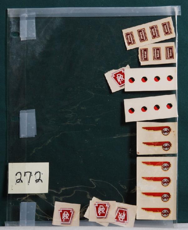 Twenty-seven decals for Lionel locos, Meyercord: Twenty-seven decals for Lionel locos, all are identifiable as Meyercord decals except the PRR keystones. Six 2352 EP-5/2360 GG1, six 2343 B unit, seven 2321 FM and eight 2349 GP-7. One 2352/2360 has a