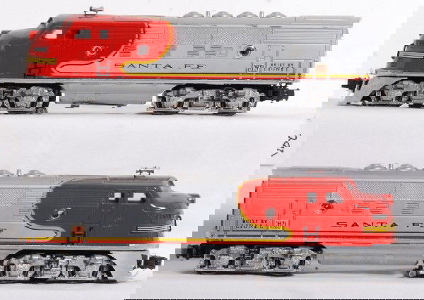 Postwar Lionel Nos. 2343P and 2343T SF F3 AA: Postwar Lionel O gauge Nos. 2343P and 2343T Santa Fe diesel F3a units with screened roof vents, porthole lens are original and repro. Trains are nice clean and shiny C6+.
