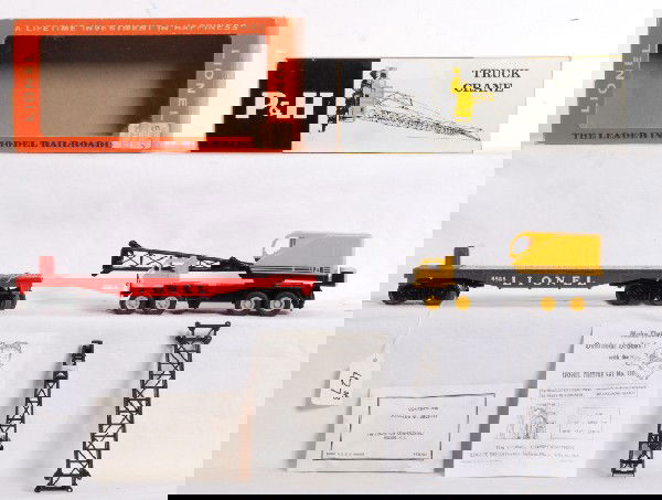 Lionel No. 6828 in OB with 6828-100 OB: Postwar Lionel O gauge No. 6828 flatcar with P&H Harnischfeger truck crane in original boxes with wrapping material and other components. Flatcar is the rare red with one original load restraint, unru